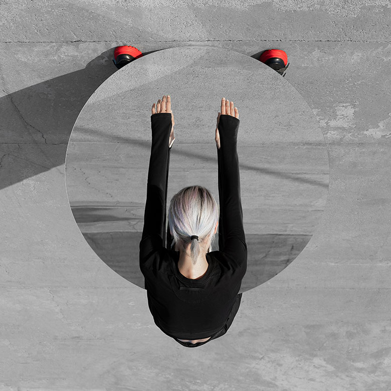 person leaning over a mirror